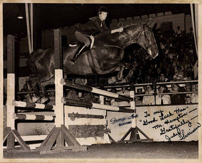 8 x 10 inch photograph. Judy Severinsen jumping over an obstacle with her horse. This photograph is dedicated to Lionel Hampton