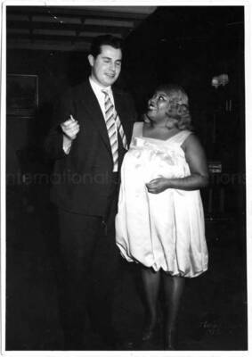 5 1/2 x 4 inch photograph. Unidentified woman and men [in Germany?]