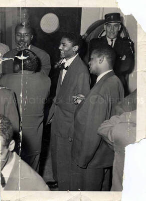 7 x 5 inch photograph. Unidentified men [in Paris, France]. This photograph is ripped