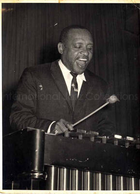 6 x 4 1/2 inch photograph. Lionel Hampton playing the vibraphone [in Belgium?]
