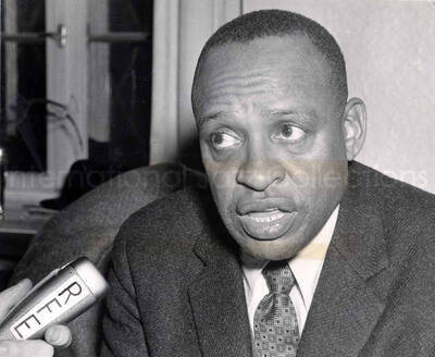 8 x 10 inch photograph. Lionel Hampton at the microphone of the Radio Free Europe, in Munich, Germany. See typewritten note in this folder