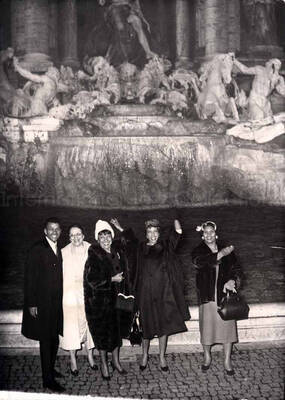 7 x 5 inch photograph. Gladys Hampton, Leo Moore, and unidentified persons at the Trevi Fountain in Rome, Italy