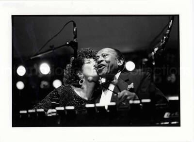7 x 9 1/2 inch photograph. Lionel Hampton on vibraphone with unidentified woman. [Paris, France?]