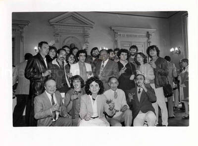 7 x 9 1/2 inch photograph. Lionel Hampton with unidentified persons [in France?]