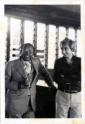 5 x 3 1/2 inch photograph. Lionel Hampton drinking Coca-Cola with Bill Titone