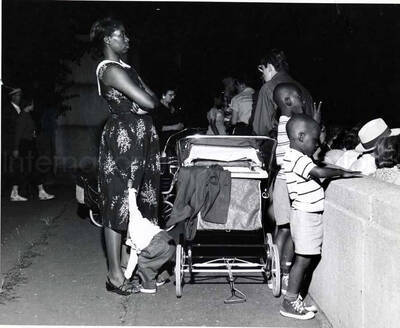 8 x 10 inch photograph. Unidentified family probably observing an outdoor event