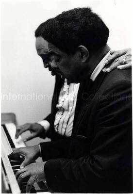 10 x 8 inch photograph. Lionel Hampton and Wild Bill Davis playing the piano