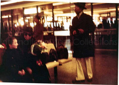 3 x 4 1/2 inch photograph. [Gladys Hampton?] with unidentified persons