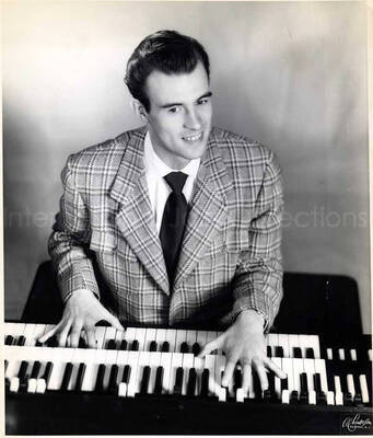 10 x 8 inch photograph. Doug Duke. Handwritten on the back of the photograph: Doug Duke, organist of Rochester, NY; First discovered by Lionel Hampton at Lenox Lounge in Harlem and first organist with Hampton Band (early 1940s)