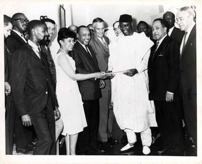 8 x 10 inch photograph. Lionel and Gladys Hampton with unidentified men