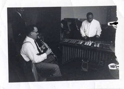 3 1/2 x 4 1/2 inch photograph. Lionel Hampton on vibraphone with [Benny Goodman] on clarinet