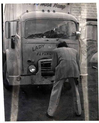 10 x 8 inch photograph. Lionel Hampton and his orchestra truck with unidentified man in front