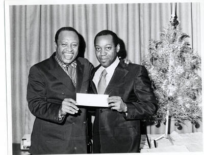 7 1/2 x 9 1/2 inch photograph. Lionel Hampton with unidentified man