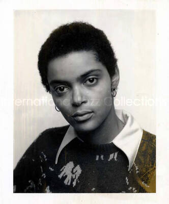 5 1/4 x 4 1/4 inch Polaroid photograph. Unidentified woman