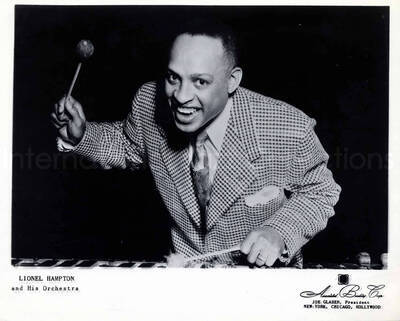8 x 10 inch promotional photograph. Lionel Hampton playing the vibraphone. Inscription on the bottom of the photograph reads: Lionel Hampton and His Orchestra