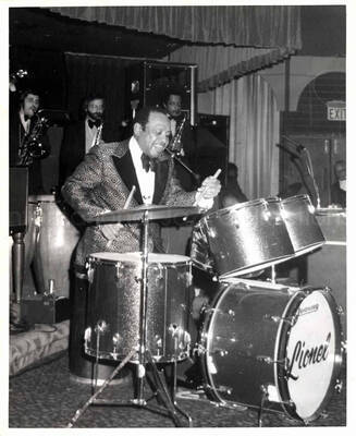 10 x 8 inch photograph. Lionel Hampton playing the drums