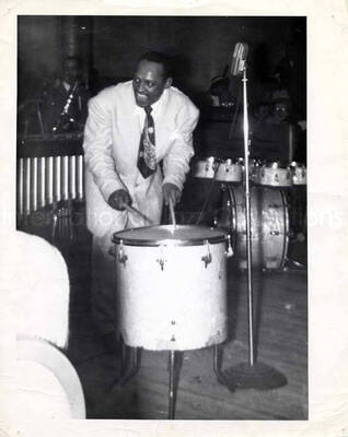 10 x 8 inch photograph. Lionel Hampton playing the drums