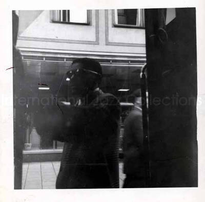 3 1/2 x 3 1/2 inch photograph. View of a street