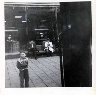 3 1/2 x 3 1/2 inch photograph. View of a street