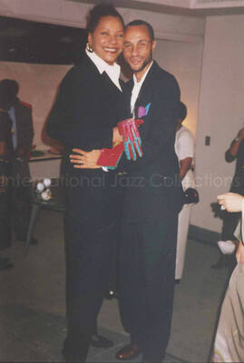 6 x 4 inch photograph. Unidentified woman and man at a fashion show