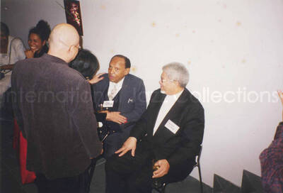 4 x 6 inch photograph. Lionel Hampton with unidentified persons at a fashion show