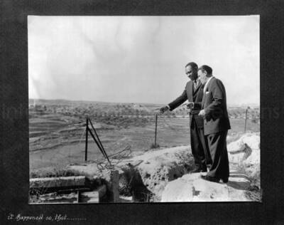 10 x 10 inch photograph. Lionel Hampton in Israel. This photograph is in a photo album titled: In the Holy City - Jerusalem. Caption under the photograph reads: it happened so, that