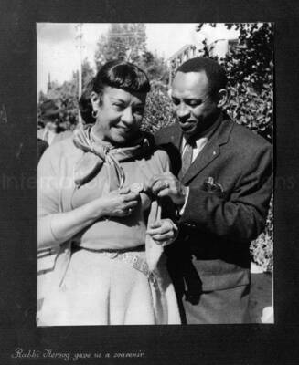 10 x 8 inch photograph. Lionel Hampton in Israel. This photograph is in a photo album titled: In the Holy City - Jerusalem. Caption under the photograph reads: Rabbi of Herzog gave us a souvenir