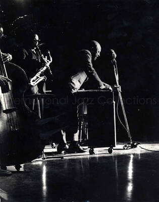 14 x 11 inch photograph. Lionel Hampton playing the vibraphone with orchestra
