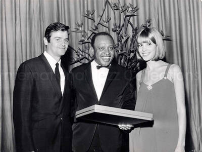 12 x 15 1/2 inch photograph. Lionel Hampton with Sergio Endrigo (Canzone Per te) and Marisa Sannia (Casa Bianca) [in San Remo, Italy?]