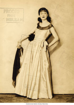 Black and white photograph of Lee Morse posing with a shawl. Stamped: Proofs from De Mirjian