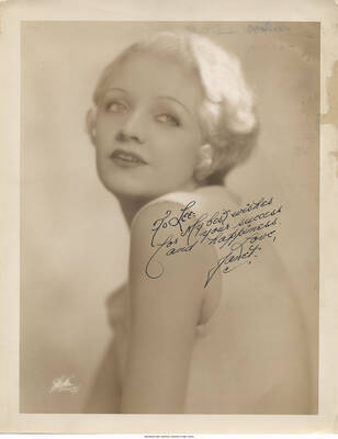 Black and white headshot of a woman. Inscription: "To Lee: My best wishes for your success and happiness.  Love, Janet"