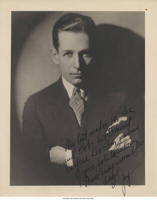 Black and white photograph of a man in a suit. Inscription: "My best wishes for "Lee" and "Bob" but I must confess Lee, I'm jealous of your potato salad.  Mine hung around for days  Jay"