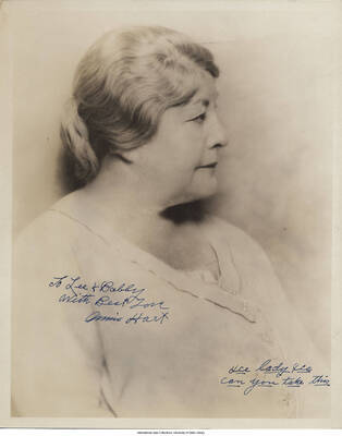 Black and white photograph of a woman. Inscription: "To Lee + Bobby  With Best Love Annie Hart. [] lady [] can you take this"