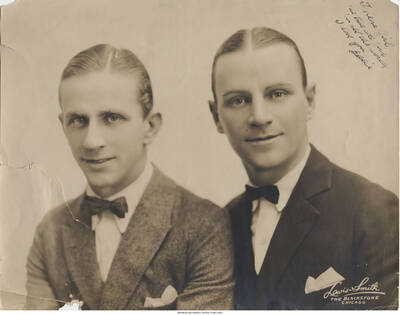 Black and white photograph of two men. Inscription: "To Lena Girl  The truest girl in all the world.  I love you Eddie"