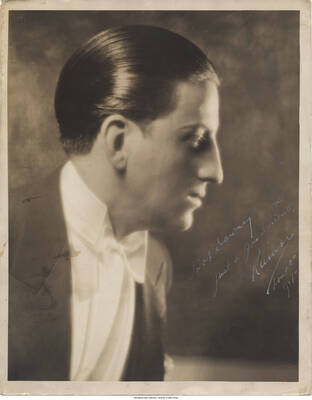 Black and white photograph of a man. Inscription: "Bob Downey  Just a good friend.  []  London 1927"
