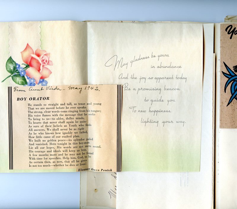 Two open graduation cards inside memories scrapbook