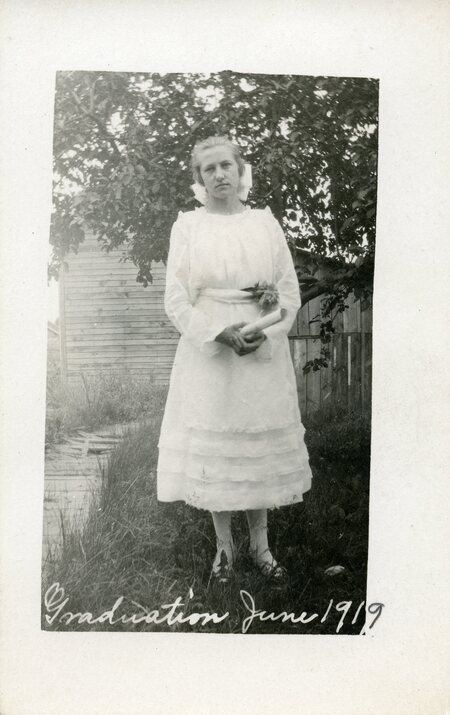 young woman holding diploma