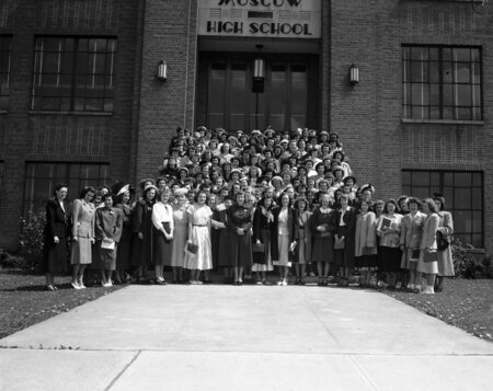 Group of people (FHA) standing in front of current MHS building