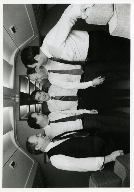 Photograph of Senator James A. McClure, Representative Richard H. Stallings, President Ronald Reagan, Representative Larry E. Craig, and Senator Steven D. Symms gathered aboard Air Force One.