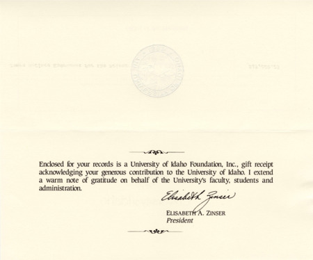 University of Idaho president Elisabeth A. Zinser provides a gift receipt for Senator James A. McClure's donation to the University of Idaho.
