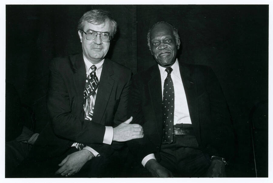 7" x 5 " black and white photograph. Lynn "Doc" Skinner sitting next two jazz musician Hank Jones.