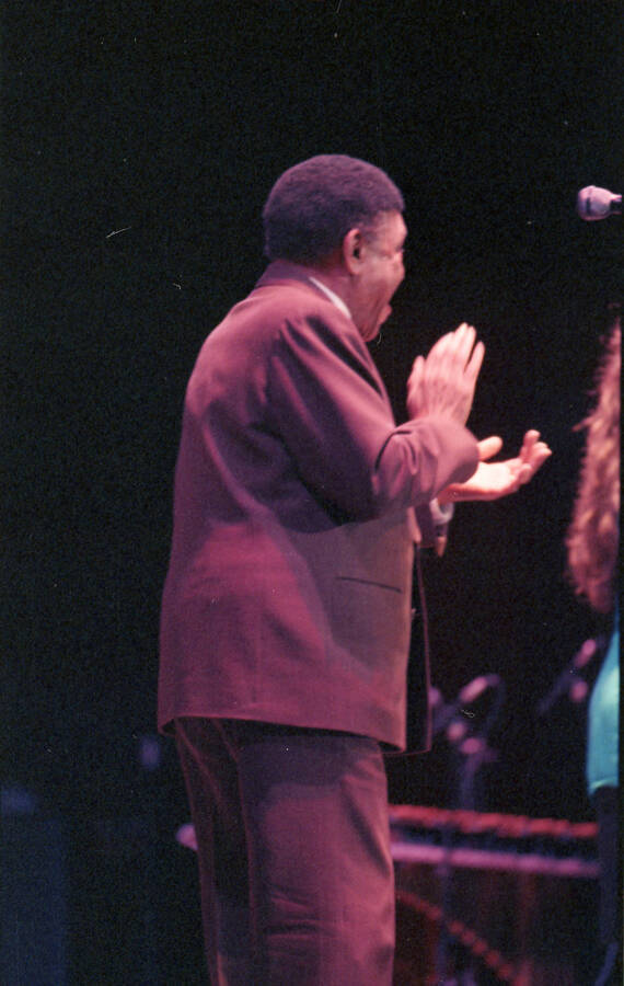 35mm color negative. Lionel Hampton claps for a student vocalist performing at the 1991 Lionel Hampton-Chevron Jazz Festival evening concert.
