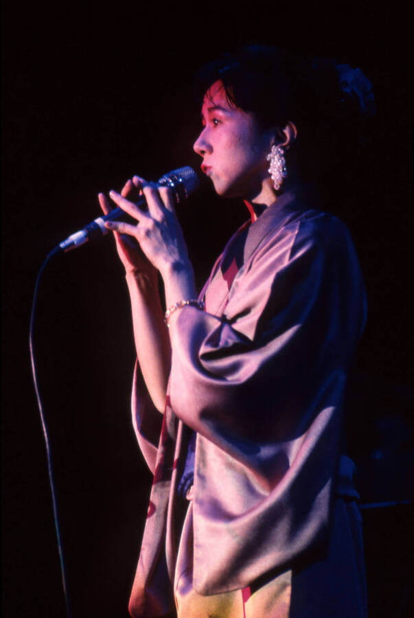 35 mm color slide. Reiko Aoki sings at the Pepsi International World Jazz Night at the 1992 Lionel Hampton-Chevron Jazz Festival wearing a kimono.