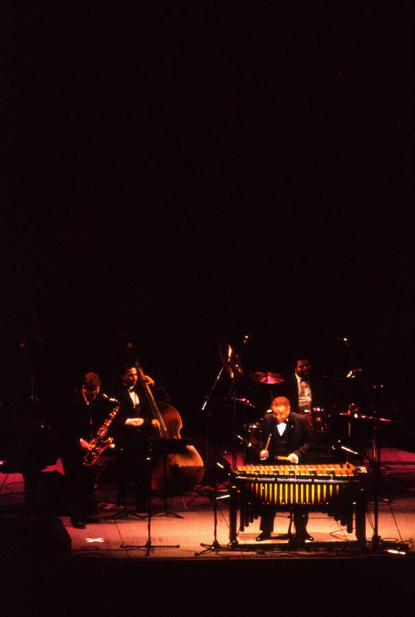 35 mm color slide. Lionel Hampton, Lembit Saarsalu, Leon Dorsey, and Wally "Gator" Watson perform at the Pepsi International World Jazz Night  at the 1992 Lionel Hampton-Chevron Jazz Festival evening concert.