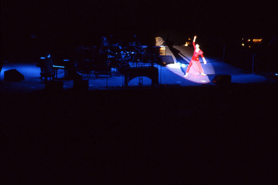 35 mm color slide. Kao Temma dances with a spotlight on her at the Pepsi International World Jazz Night at the 1992 Lionel Hampton-Chevron Jazz Festival.