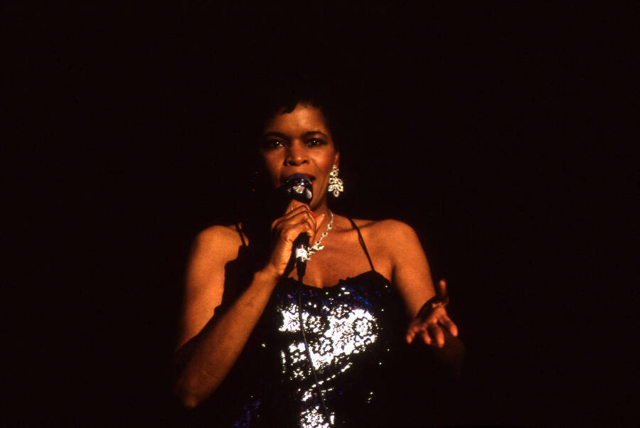 35 mm color slide. Lisa Capers sings on stage at the Pepsi International World Jazz Night at the 1992 Lionel Hampton-Chevron Jazz Festival.