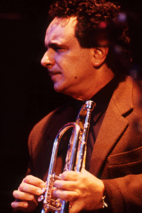 35 mm color slide. Claudio Roditi holds a trumpet on stage at the Pepsi International World Jazz Night at the 1992 Lionel Hampton-Chevron Jazz Festival.