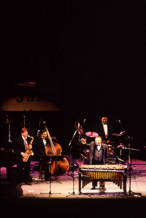 35 mm color slide. Lionel Hampton, Lembit Saarsalu, Leon Dorsey, and Wally "Gator" Watson perform at the Pepsi International World Jazz Night  at the 1992 Lionel Hampton-Chevron Jazz Festival evening concert.