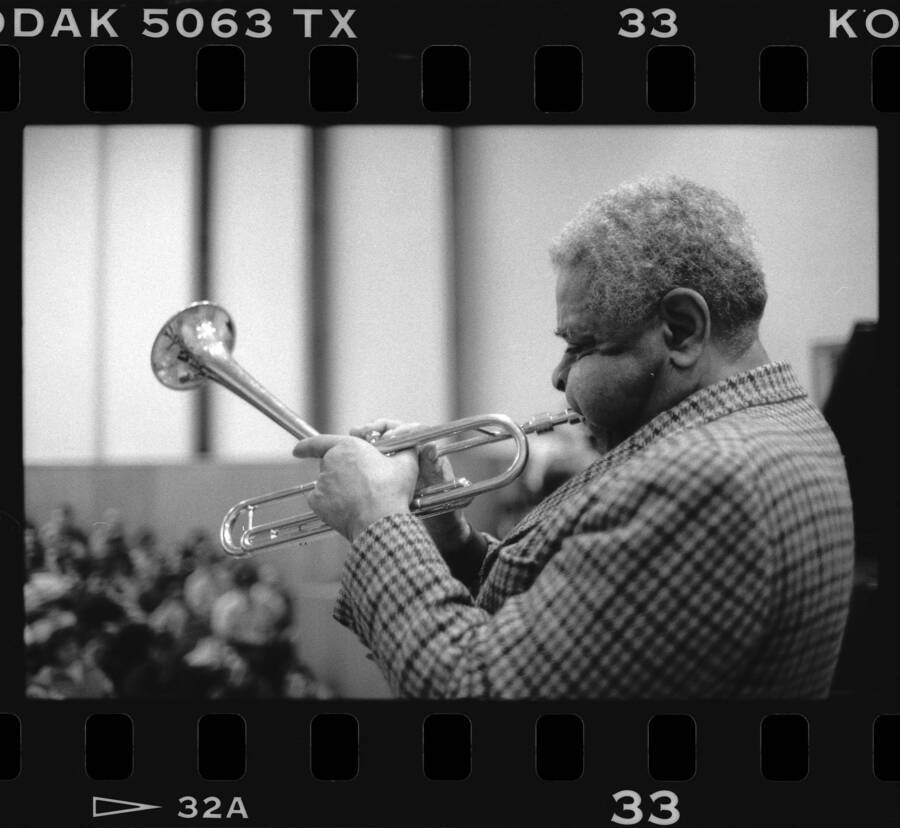 1.5" x 1" black and white print. One of thirty images found on a contact sheet. Dizzy Gillespie playing trumpet during his jazz clinic.
