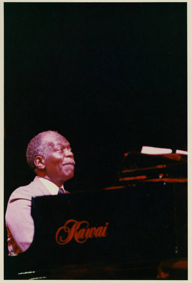 8" x 10" color photograph. Hank Jones sits at a Kawai piano at the Lionel Hampton Jazz Festival.